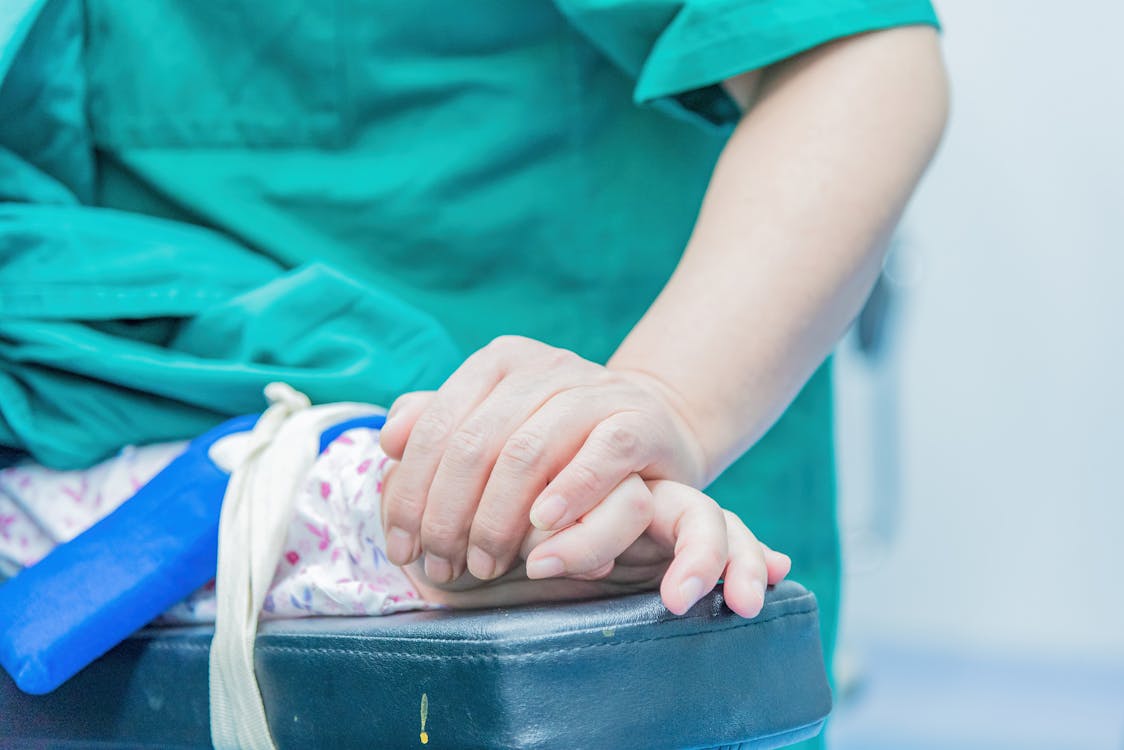 Doctor providing care and support to a patient in a medical setting