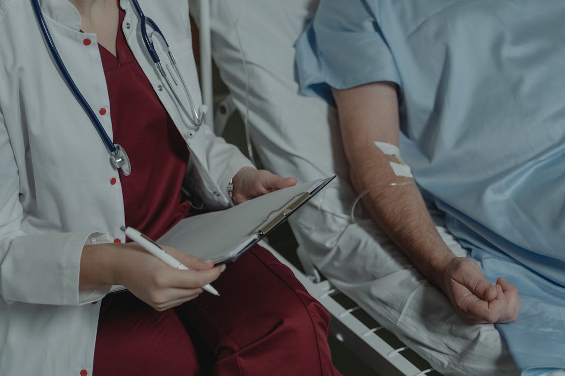 Healthcare professional reviewing recovery progress with patient