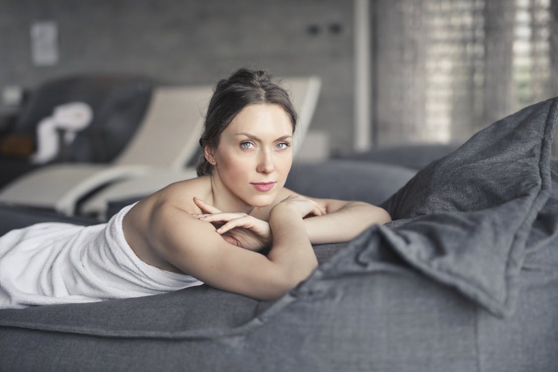 Person relaxing during a professional wellness treatment session